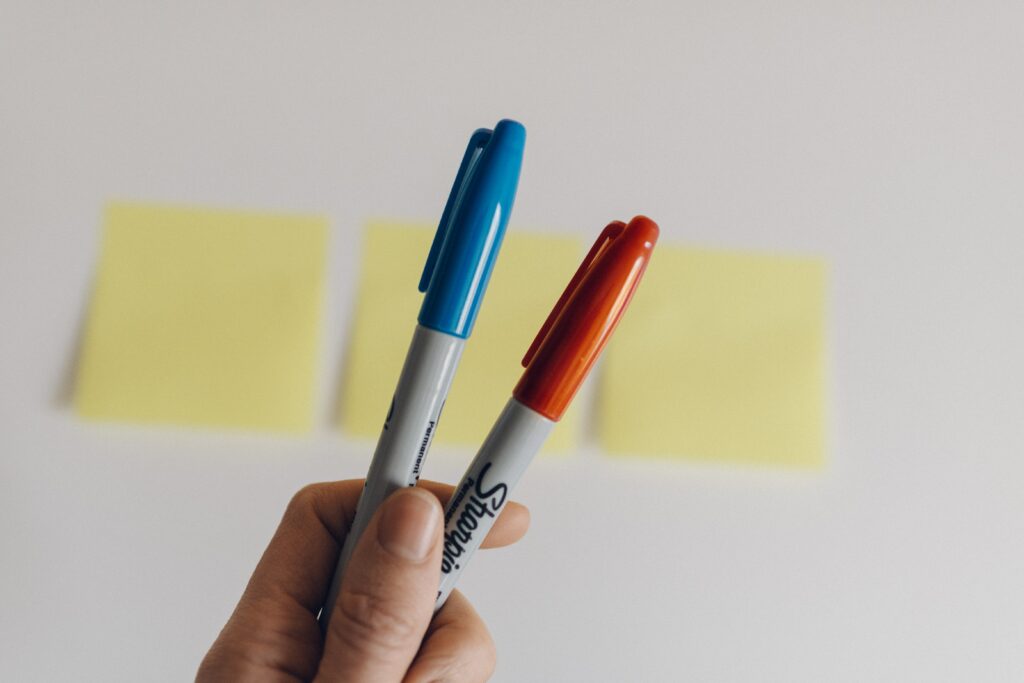 Holding two pens